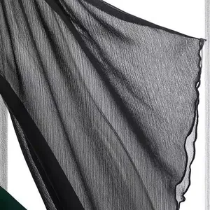 Gothic black chiffon top featuring dramatic flared bell sleeves with ruffled edges.