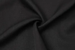 Close-up macro shot of black fabric texture for sequined patchwork fashion dress