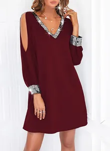 Macro view of burgundy cold-shoulder mini dress featuring elegant sequin V-neck trim