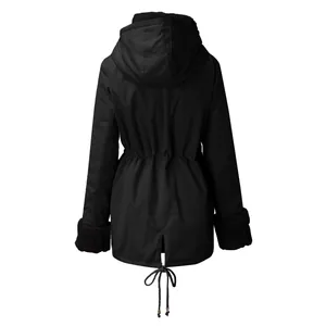 Back view of women's black hooded winter parka with drawstring waist and fur cuffs