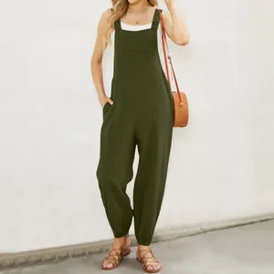 Full body view of army green cotton linen jumpsuit with button straps and pockets
