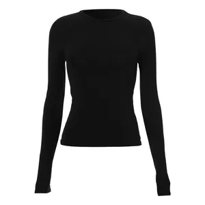Detail shot of a women's black long sleeve raglan T-shirt with a slim fit cut.