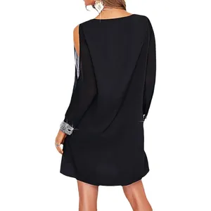 Elegant black cold shoulder mini dress featuring sparkling sequin cuffs and a loose fit