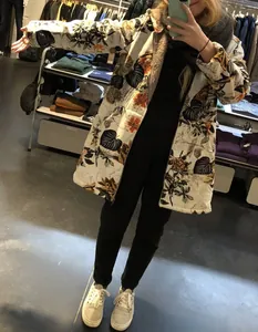 Women's thick hooded padded coat with tropical botanical print and zipper closure