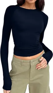 Detailed view of women's slim-fit navy blue raglan long sleeve crew neck T-shirt