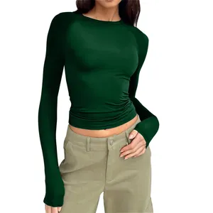Close-up detail view of dark green raglan long sleeve slim fit crew neck top for women