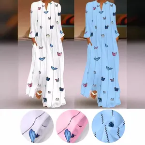 Robe longue vintage à imprimé papillon avec col en V, manches longues et poches.