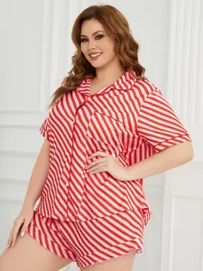 Close-up of a plus size red striped pajama set featuring a button-up shirt and shorts