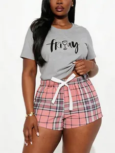 Casual women's two-piece pajama set with grey Friday t-shirt and pink plaid shorts
