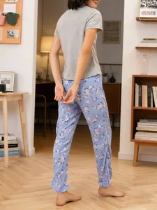 Women's casual home wear pajama set with grey t-shirt and blue floral print pants