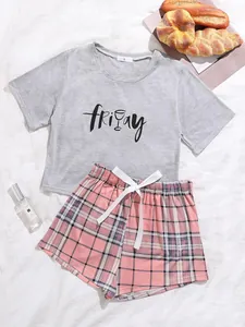 Detail view of women's grey 'friday' print pajama set with pink plaid shorts.