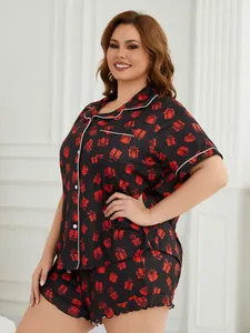 Plus size women's pajama set featuring a black short-sleeve top and shorts with red gift print