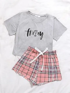 Detail view of women's gray Friday print t-shirt and pink plaid pajama shorts set
