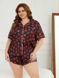 Plus size women's pajama set featuring short sleeves and shorts with festive gift box prints.