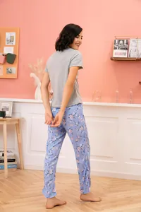 Back view of women's short sleeve grey t-shirt and light blue floral print pajama pants