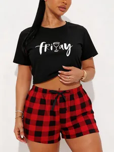 Casual women's pajama set with Friday printed black T-shirt and red plaid shorts