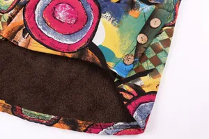 Detail view of colorful printed jacket showing thick brown fleece lining and wooden buttons