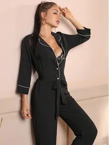 Modern black long sleeve pajama jumpsuit for women featuring elegant white piping