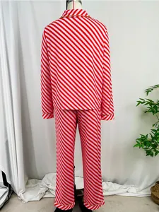 Back view of women's red and pink diagonal striped pajama set with elegant gold trim