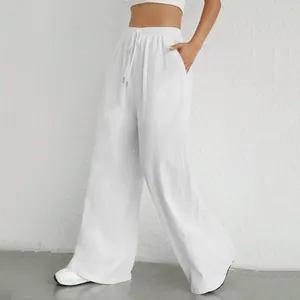 Pantaloni bianchi a vita alta a gamba larga con coulisse elastica e comode tasche