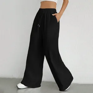 Pantaloni neri a gamba larga da donna con coulisse elastica in vita e vestibilità comoda