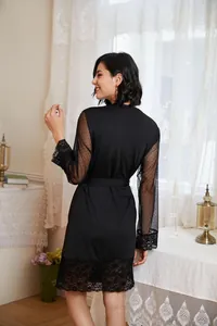 Rear view detail of black lace mesh robe featuring breathable polka dot long sleeves and lace trim