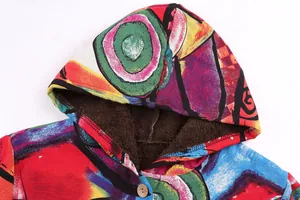 Close-up of vibrant abstract printed jacket hood with warm dark brown faux fur lining.