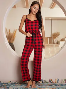 Red and black buffalo plaid camisole jumpsuit pajama set on model
