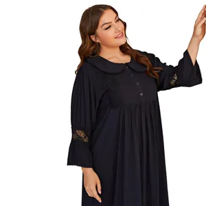 Detailed view of plus size black nightdress with lace embroidery and button accents
