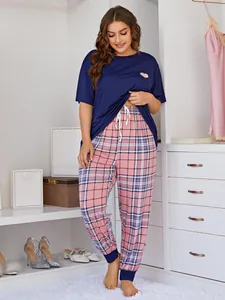 Detailed full-body view of plus size pajama set featuring navy heart tee and plaid pants