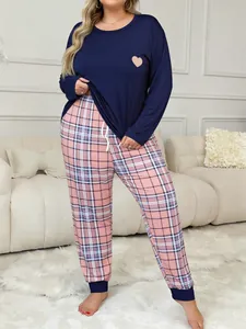 Plus size women's loungewear set with navy heart print top and pink plaid pants