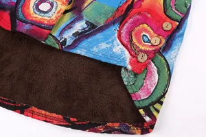 Close-up of colorful abstract jacket with warm brown fleece lining and wooden buttons.