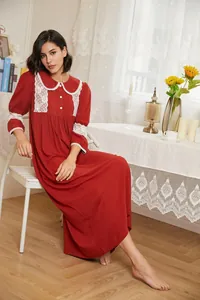 Vintage red palace style nightgown with delicate white lace trim and long sleeves.