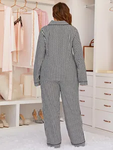 Back view of plus size women's black and white striped long sleeve pajama set