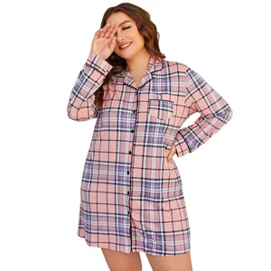 Close-up detail of women's plus size long sleeve pink plaid button-down nightshirt.