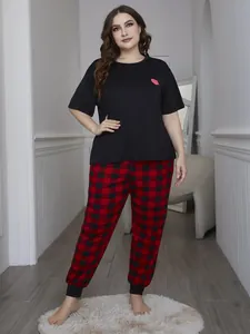 Detail showing comfortable plus size pajama set with heart top and buffalo plaid pants
