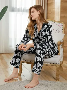 Close-up detail of women's long-sleeve floral print pajama set in a cozy home setting