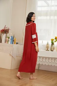 Back view of a red Victorian style long sleeve nightgown with white lace detailing