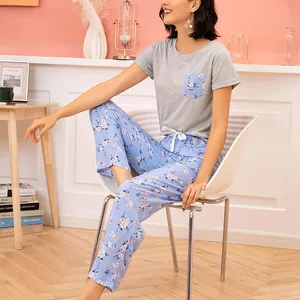 Women's two-piece floral pajama set with grey short sleeve top and blue long pants