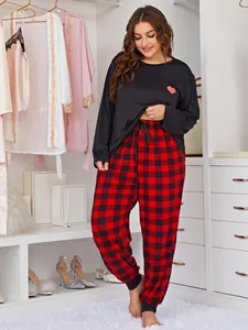 Plus size two-piece pajama set featuring a heart print top and red buffalo plaid pants