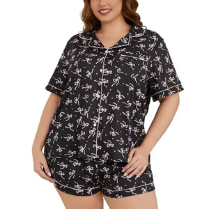 Comfortable plus size women's pajama set with pink bow print on black fabric for home wear
