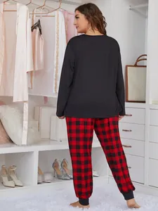 Plus size two-piece pajama set with black long sleeve top and red buffalo plaid pants