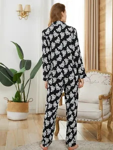 Back view of women's black and white floral print long sleeve pajama set for home