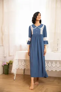 Elegant Victorian blue nightgown featuring white lace collar and delicate sleeve details.
