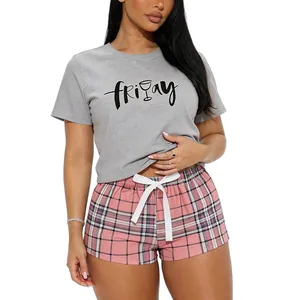 Comfortable women's 2-piece pajama set with Friday print t-shirt and pink plaid shorts