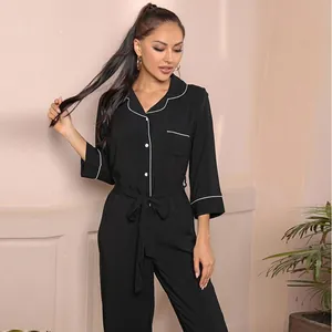 Elegant black long-sleeved jumpsuit pajamas for women with white piping and waist tie