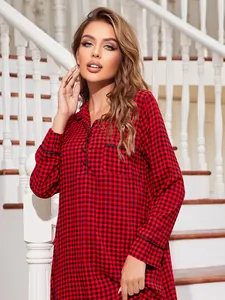 Detail of the red plaid pattern on a long-sleeved Christmas nightgown