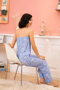 Detail of women's light blue floral camisole and long pants two-piece pajama set