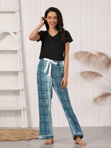 Two-piece women's pajama set featuring black V-neck top and snakeskin print pants
