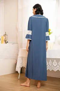 Detailed back view of a vintage blue nightgown featuring elegant white lace trim